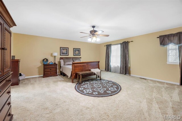 24 Milton Brennan Manor Ct, Wentzville, MO 63385 - bedroom with multiple windows, light colored carpet, and a ceiling fan