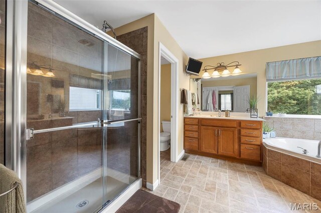 24 Milton Brennan Manor Ct, Wentzville, MO 63385 - bathroom with vanity, a garden tub, and a shower stall