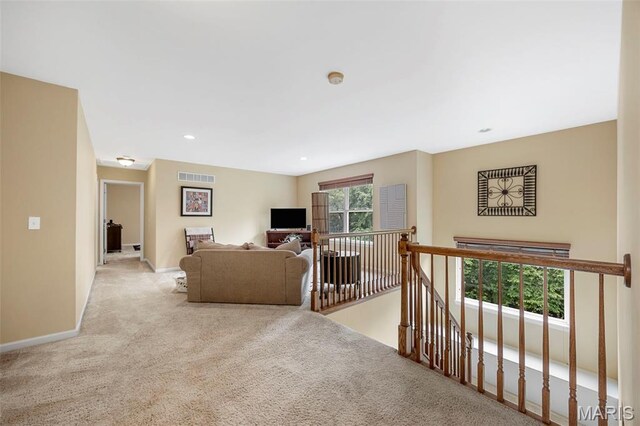 24 Milton Brennan Manor Ct, Wentzville, MO 63385 - carpeted living area with baseboards and recessed lighting