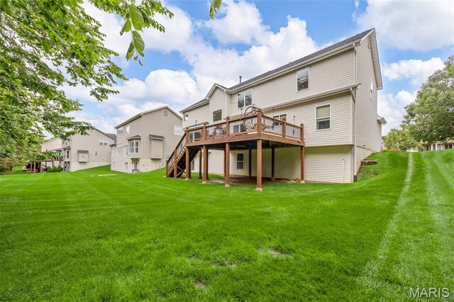 24 Milton Brennan Manor Ct, Wentzville, MO 63385 - back of property with a deck, stairs, and a yard
