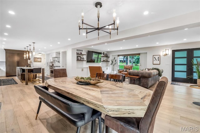 1607 Wyncliff Ln, Frontenac, MO 63131 - dining room with a chandelier, light wood-style flooring, and recessed lighting