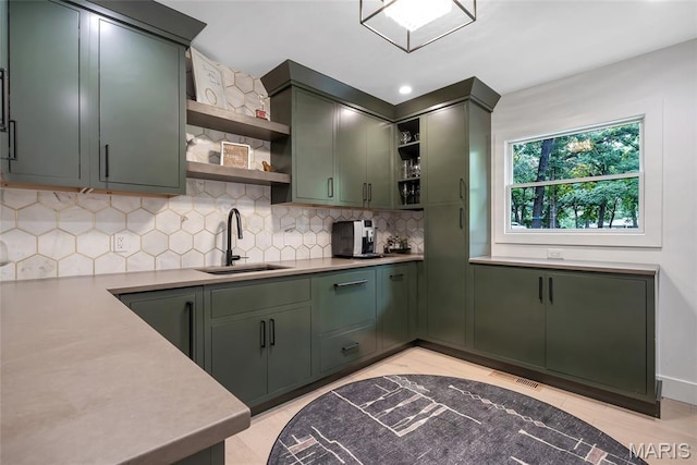 1607 Wyncliff Ln, Frontenac, MO 63131 - kitchen with green cabinets, open shelves, backsplash, and light countertops