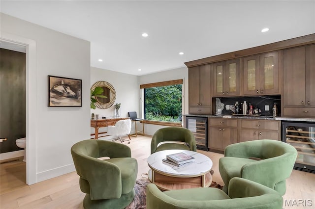 1607 Wyncliff Ln, Frontenac, MO 63131 - indoor dry bar featuring wine cooler, light wood-type flooring, recessed lighting, and decorative backsplash