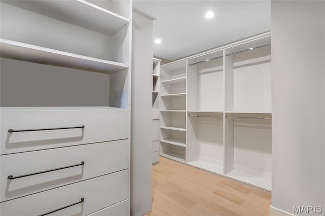 1607 Wyncliff Ln, Frontenac, MO 63131 - spacious closet featuring light wood-style floors