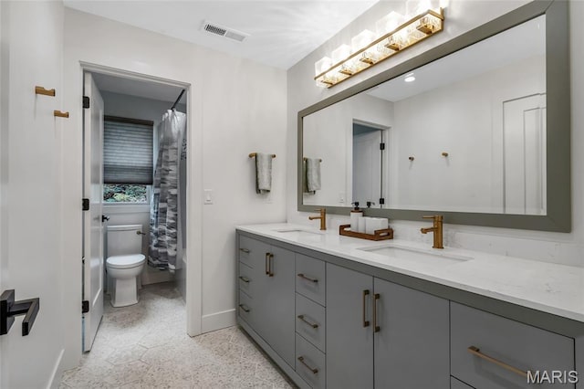 1607 Wyncliff Ln, Frontenac, MO 63131 - bathroom featuring double vanity and speckle patterned floor