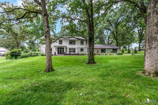 1607 Wyncliff Ln, Frontenac, MO 63131 - view of front facade featuring french doors and a front yard