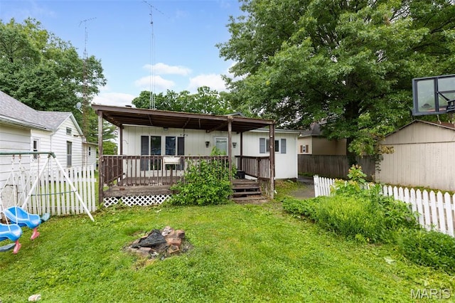 912 N Illinois Ave, Litchfield, IL 62056 - back of property with a wooden deck and a shed