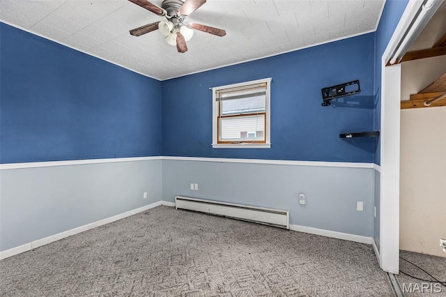 912 N Illinois Ave, Litchfield, IL 62056 - spare room with a baseboard radiator, ceiling fan, and carpet