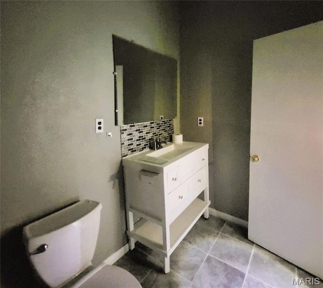 945 Cedar St, Poplar Bluff, MO 63901 - bathroom with vanity, tasteful backsplash, and tile patterned floors