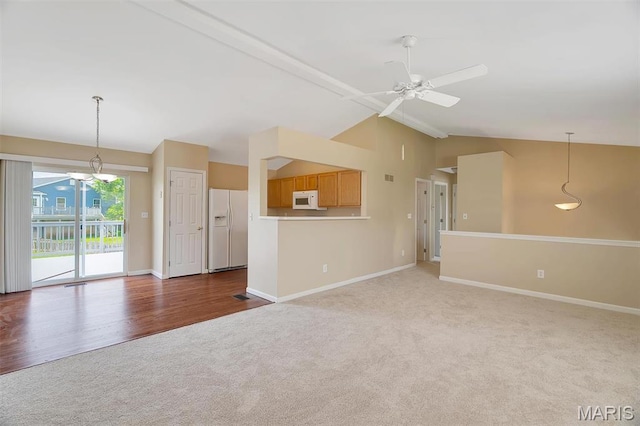 536 White Fence Dr, Wentzville, MO 63385 - unfurnished living room featuring lofted ceiling, carpet floors, and a ceiling fan