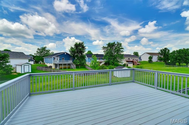 536 White Fence Dr, Wentzville, MO 63385 - wooden deck with a residential view, a storage unit, and a yard
