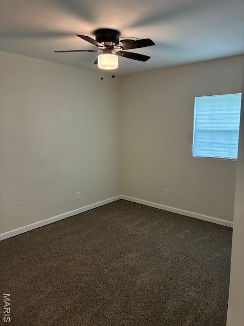 515 N 37th St, Belleville, IL 62226 - unfurnished room featuring a ceiling fan and dark colored carpet