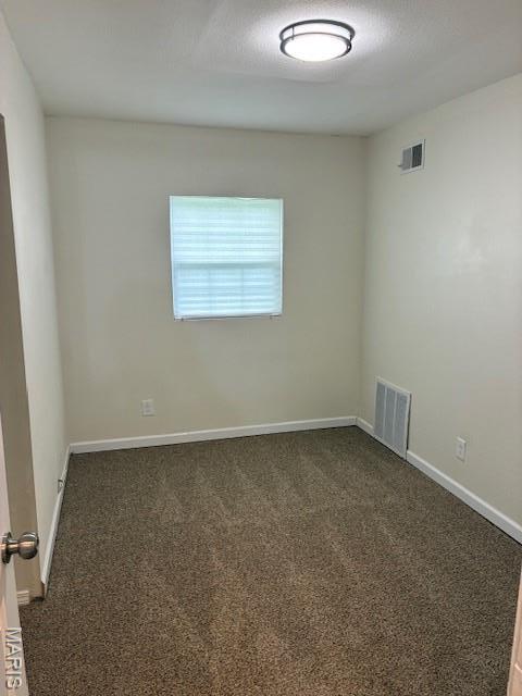 515 N 37th St, Belleville, IL 62226 - unfurnished room with dark carpet and baseboards