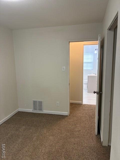 515 N 37th St, Belleville, IL 62226 - carpeted empty room featuring baseboards