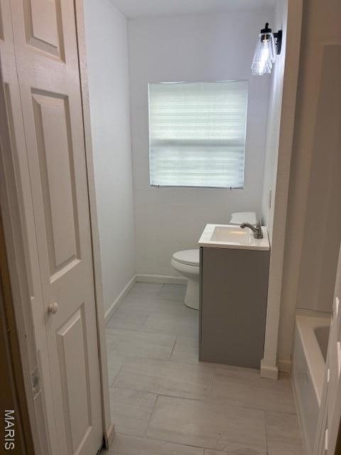 515 N 37th St, Belleville, IL 62226 - full bath featuring vanity, a bath, and tile patterned flooring