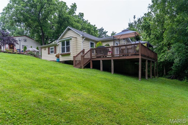 623 Boyne St, De Soto, MO 63020 - back of property featuring a wooden deck, a lawn, and stairs