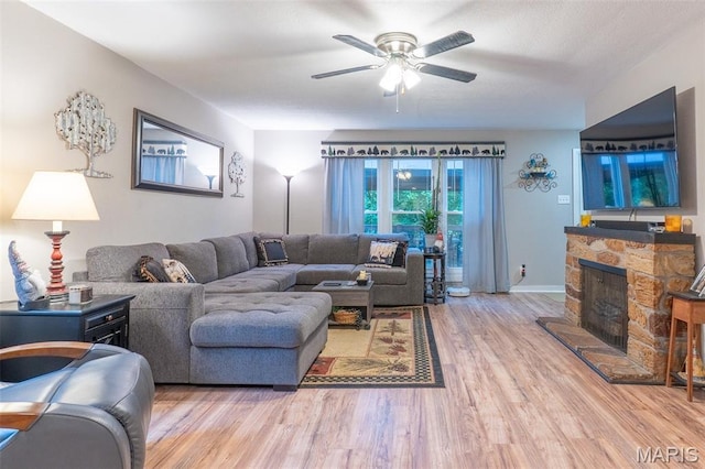 623 Boyne St, De Soto, MO 63020 - living room with wood finished floors, ceiling fan, and a fireplace