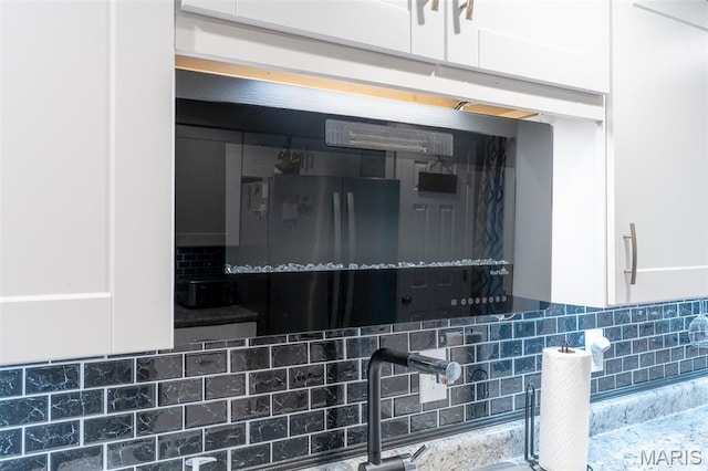 623 Boyne St, De Soto, MO 63020 - kitchen view of decorative backsplash and white cabinets