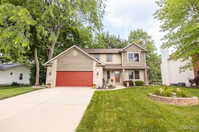 595 Chancellor Dr, Edwardsville, IL 62025 - view of front of property with a front lawn, a garage, concrete driveway, and brick siding