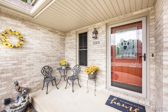 595 Chancellor Dr, Edwardsville, IL 62025 - property entrance with brick siding and covered porch