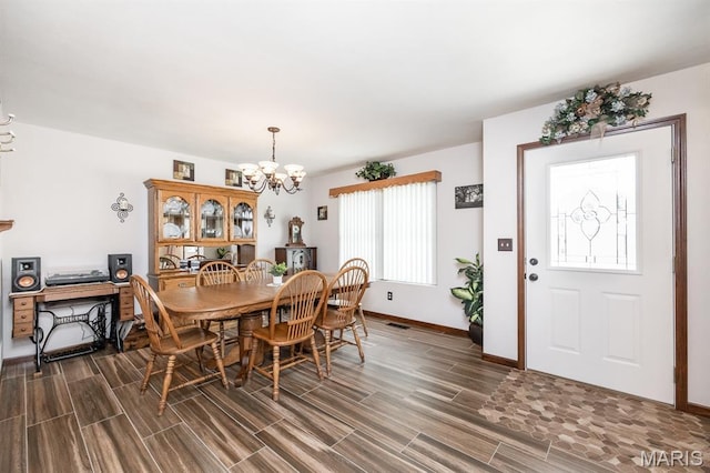 595 Chancellor Dr, Edwardsville, IL 62025 - dining room featuring a chandelier and wood finish floors