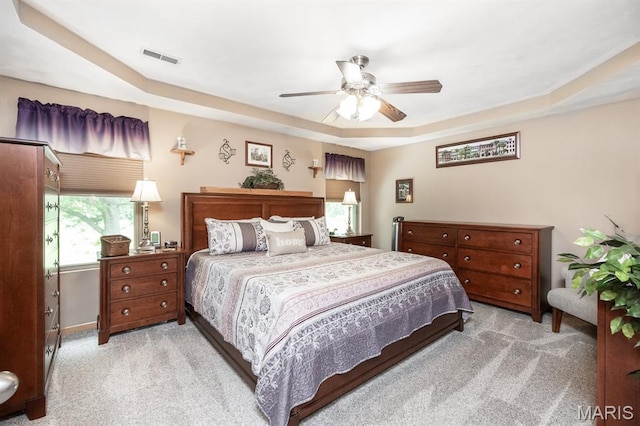 595 Chancellor Dr, Edwardsville, IL 62025 - bedroom with carpet flooring, a raised ceiling, and a ceiling fan