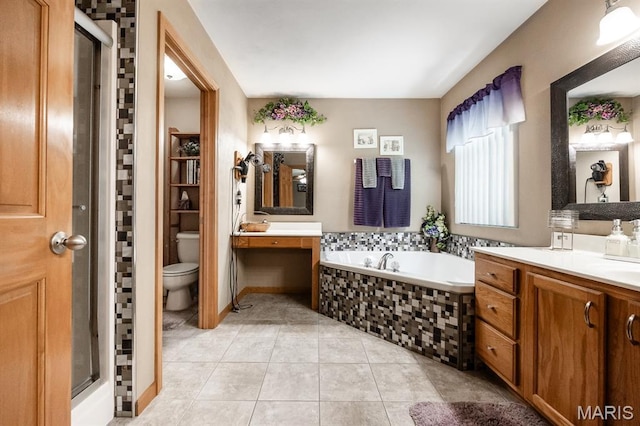 595 Chancellor Dr, Edwardsville, IL 62025 - full bath with tile patterned flooring, a bath, vanity, and a stall shower