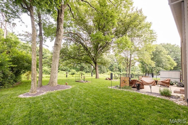 595 Chancellor Dr, Edwardsville, IL 62025 - view of yard featuring a patio and view of wooded area