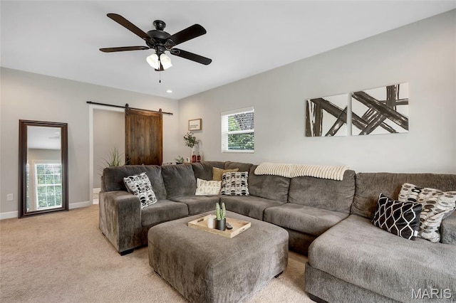 4004 W Dr, Saint Peters, MO 63376 - living room with a barn door, a ceiling fan, and light colored carpet