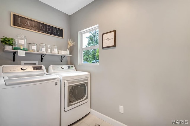 4004 W Dr, Saint Peters, MO 63376 - laundry area featuring independent washer and dryer and light tile patterned flooring