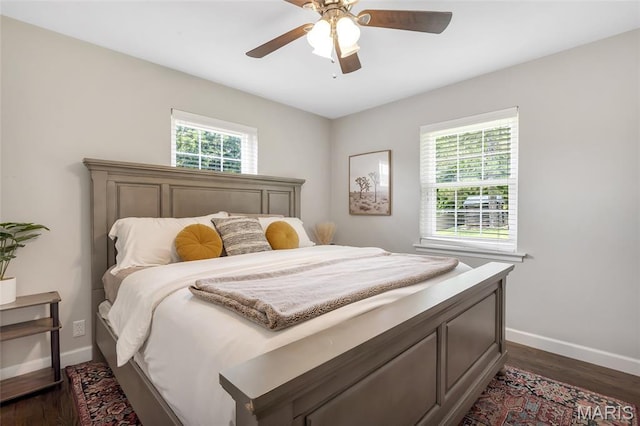 4004 W Dr, Saint Peters, MO 63376 - bedroom with multiple windows, dark wood-style flooring, and ceiling fan