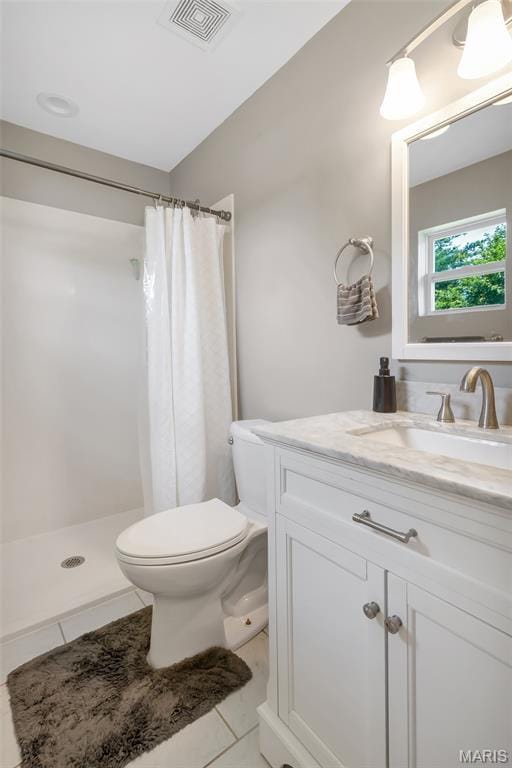 4004 W Dr, Saint Peters, MO 63376 - bathroom featuring vanity, tile patterned flooring, and a stall shower