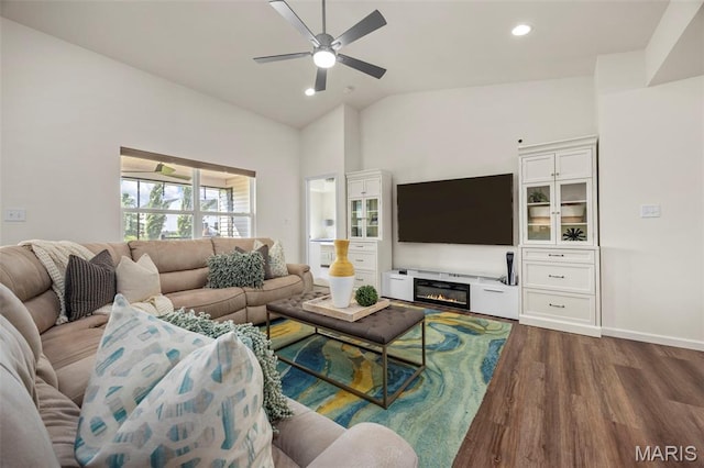 155 Pampano Ln, Saint Charles, MO 63301 - living area featuring dark wood finished floors, vaulted ceiling, a ceiling fan, a glass covered fireplace, and recessed lighting