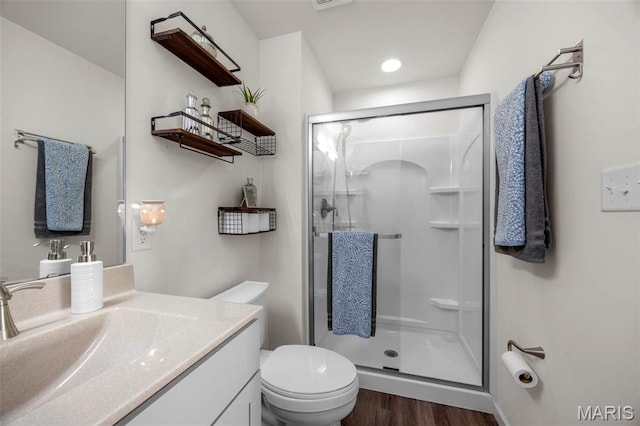 155 Pampano Ln, Saint Charles, MO 63301 - bathroom with a stall shower, wood finished floors, vanity, and recessed lighting