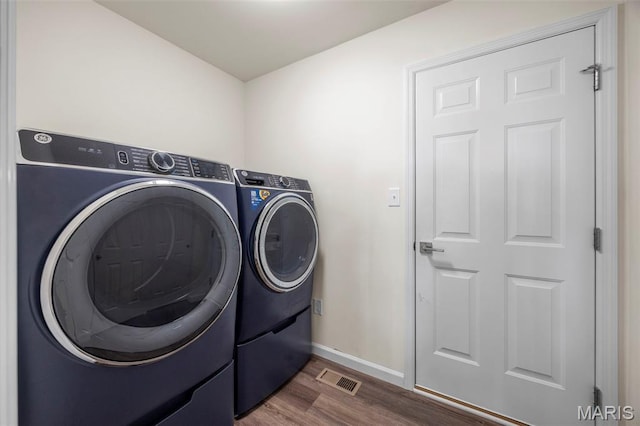 155 Pampano Ln, Saint Charles, MO 63301 - laundry area featuring washer and dryer and dark wood-style floors