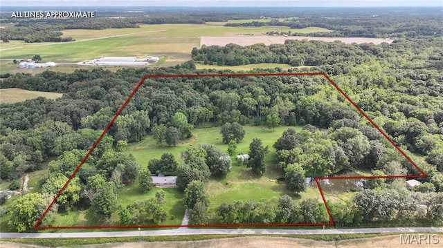 6155 Raymond Rd, Bunker Hill, IL 62014 - aerial view of property and surrounding area featuring property parcel outlined and a heavily wooded area