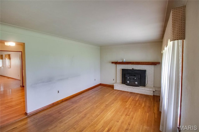 6155 Raymond Rd, Bunker Hill, IL 62014 - unfurnished living room featuring wood finished floors and baseboards
