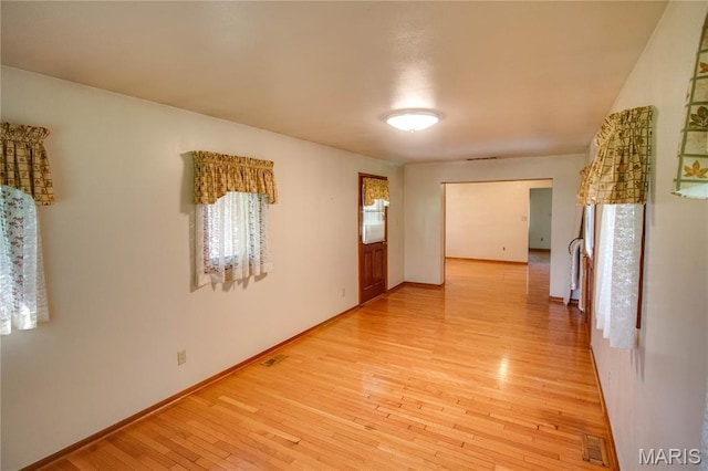 6155 Raymond Rd, Bunker Hill, IL 62014 - unfurnished room featuring light wood-type flooring and baseboards