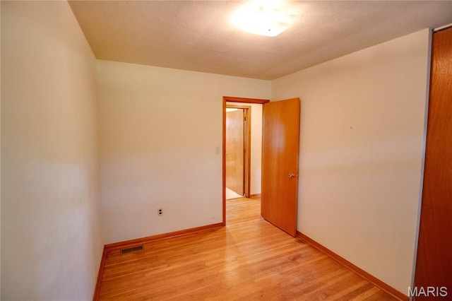 6155 Raymond Rd, Bunker Hill, IL 62014 - unfurnished room with light wood finished floors and baseboards