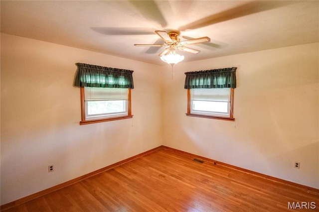 6155 Raymond Rd, Bunker Hill, IL 62014 - spare room with plenty of natural light, wood finished floors, and ceiling fan