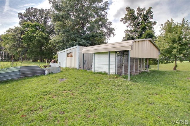 6155 Raymond Rd, Bunker Hill, IL 62014 - view of green lawn with an outbuilding and a garage