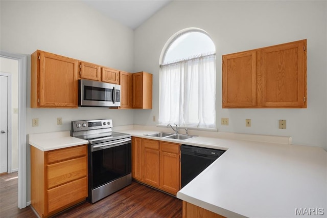 527 Wetherby Terrace Dr, Ballwin, MO 63021 - kitchen featuring appliances with stainless steel finishes, dark wood-style flooring, and light countertops