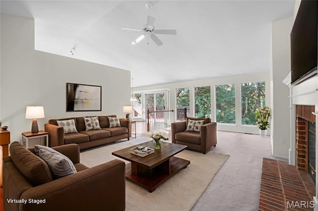 527 Wetherby Terrace Dr, Ballwin, MO 63021 - living area with a fireplace, a ceiling fan, carpet, and high vaulted ceiling