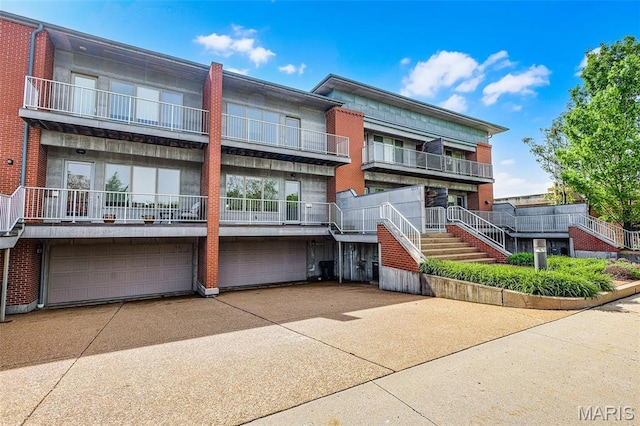 5310 Chouteaus Bluff Dr Unit 5310, Saint Louis, MO 63111 - view of property featuring an attached garage and concrete driveway