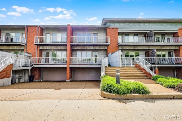 5310 Chouteaus Bluff Dr Unit 5310, Saint Louis, MO 63111 - view of property featuring a garage and concrete driveway