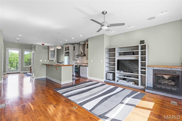 5310 Chouteaus Bluff Dr Unit 5310, Saint Louis, MO 63111 - unfurnished living room with a ceiling fan, wood finished floors, recessed lighting, and a high end fireplace