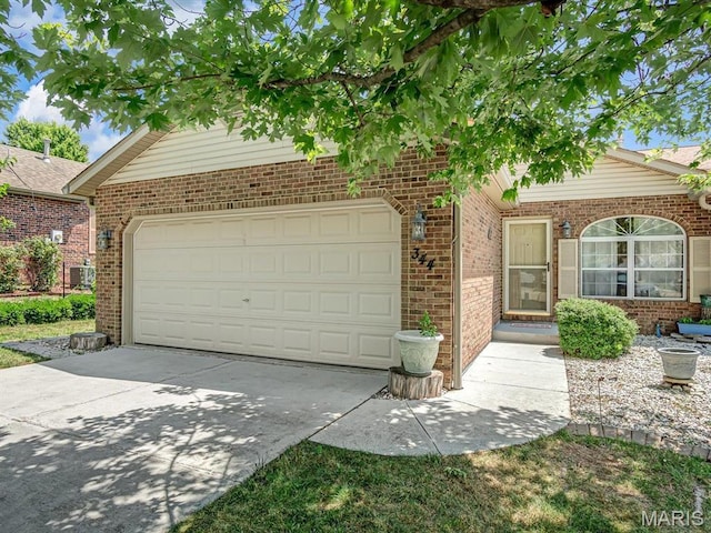 344 Westline Ct, Shiloh, IL 62221 - view of front of property with a garage, concrete driveway, and brick siding