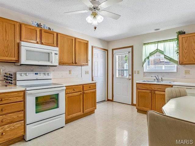 344 Westline Ct, Shiloh, IL 62221 - kitchen with white appliances, a textured ceiling, light countertops, light flooring, and brown cabinets