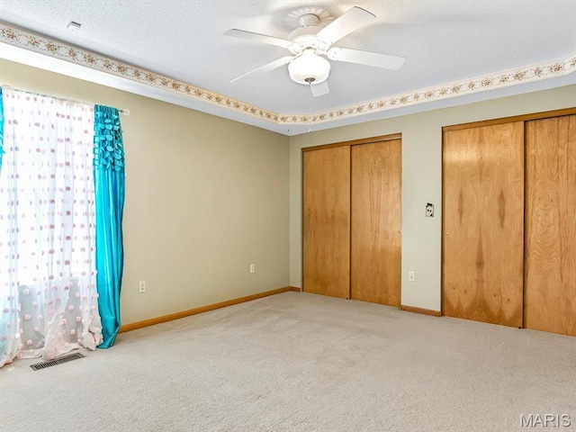 344 Westline Ct, Shiloh, IL 62221 - unfurnished bedroom featuring multiple closets, carpet floors, and ceiling fan
