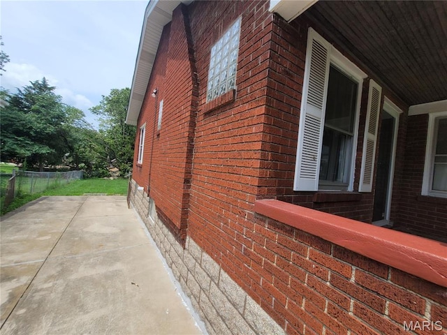 2965 Kincaid Ave, St John, MO 63114 - view of side of property featuring brick siding and crawl space